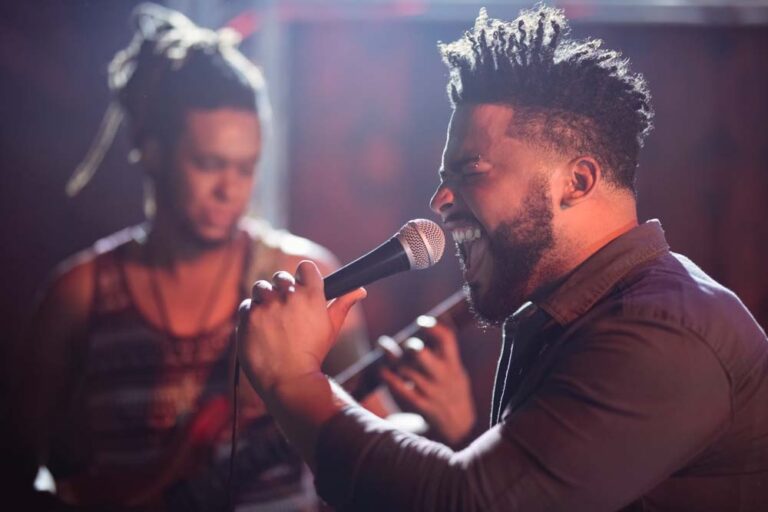 Male singer performing on stage at nightclub